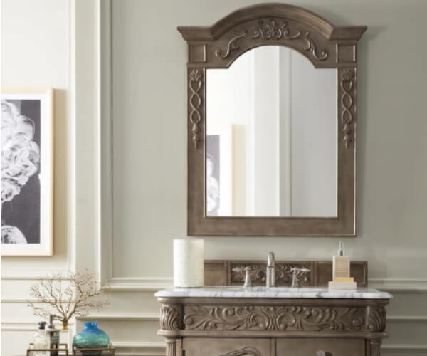 Antique carved vanity with arched mirror